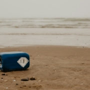 blue and white surfboard on beach during daytime