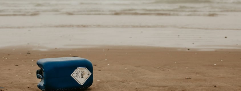 blue and white surfboard on beach during daytime